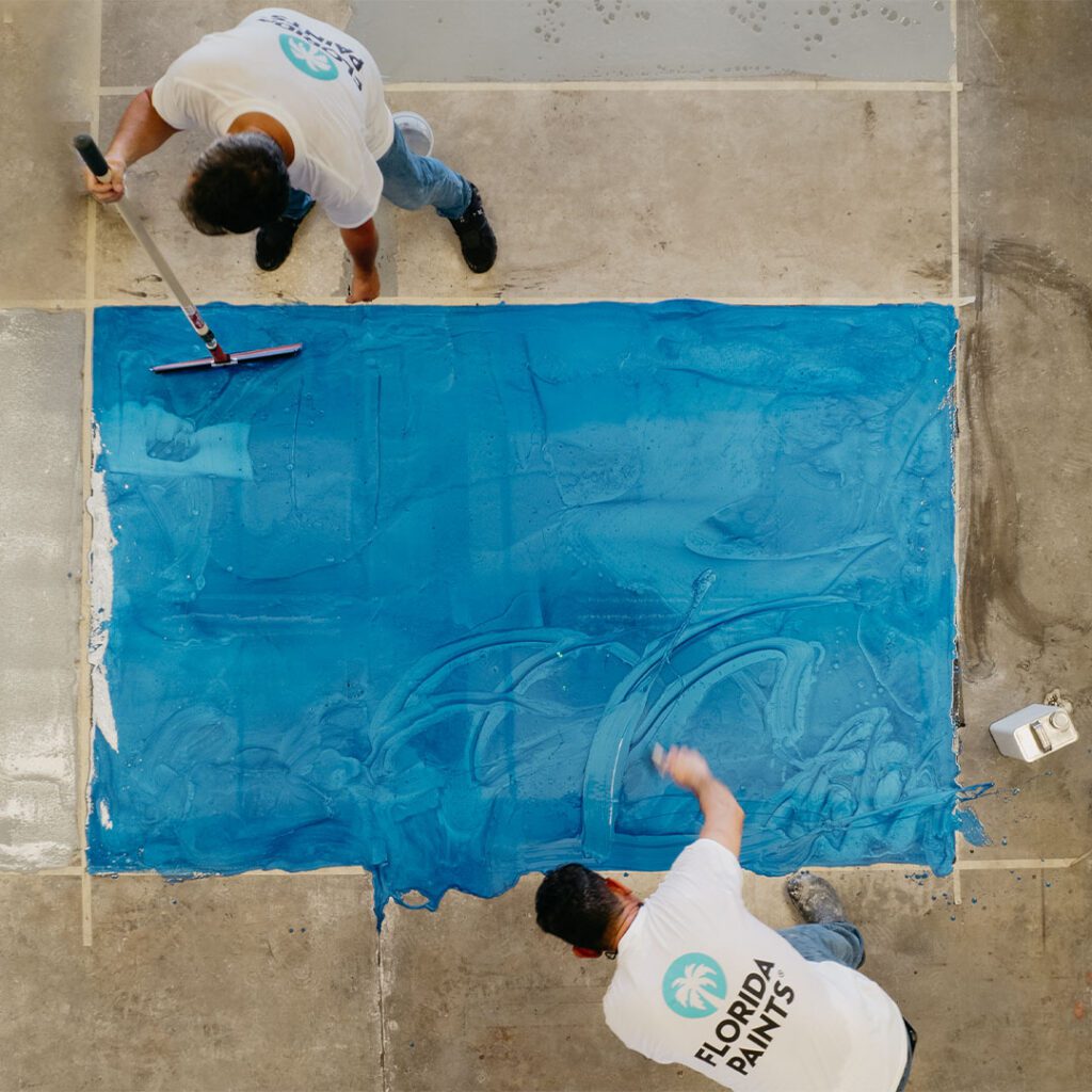 Florida Paints employees doing an epoxy demo