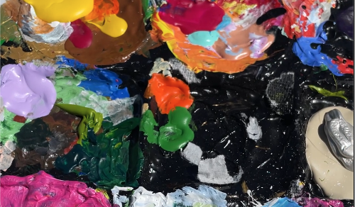 Close-up of a paint palette featuring bright Florida Paints colors used during the community event.